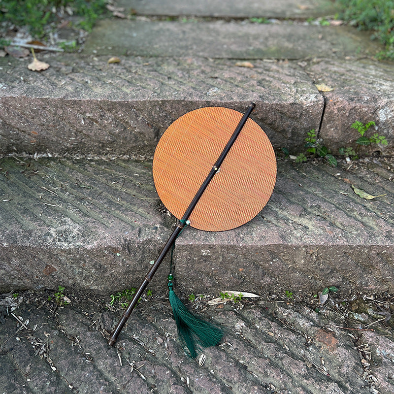 Whispers of Summer: Hand-woven bamboo silk fan with rollable design and tassel