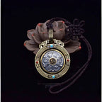 Six-Syllable Mantra Spinning Lotus Pendant – Silver & Brass